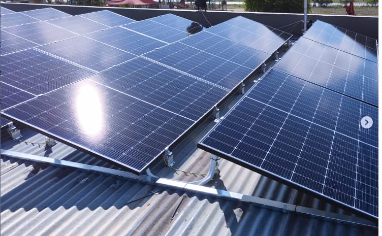 Solar panels installed on a residential roof on a sunny day
